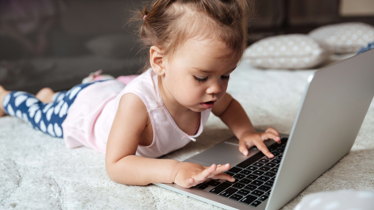 Young girl using laptop computer and social media
